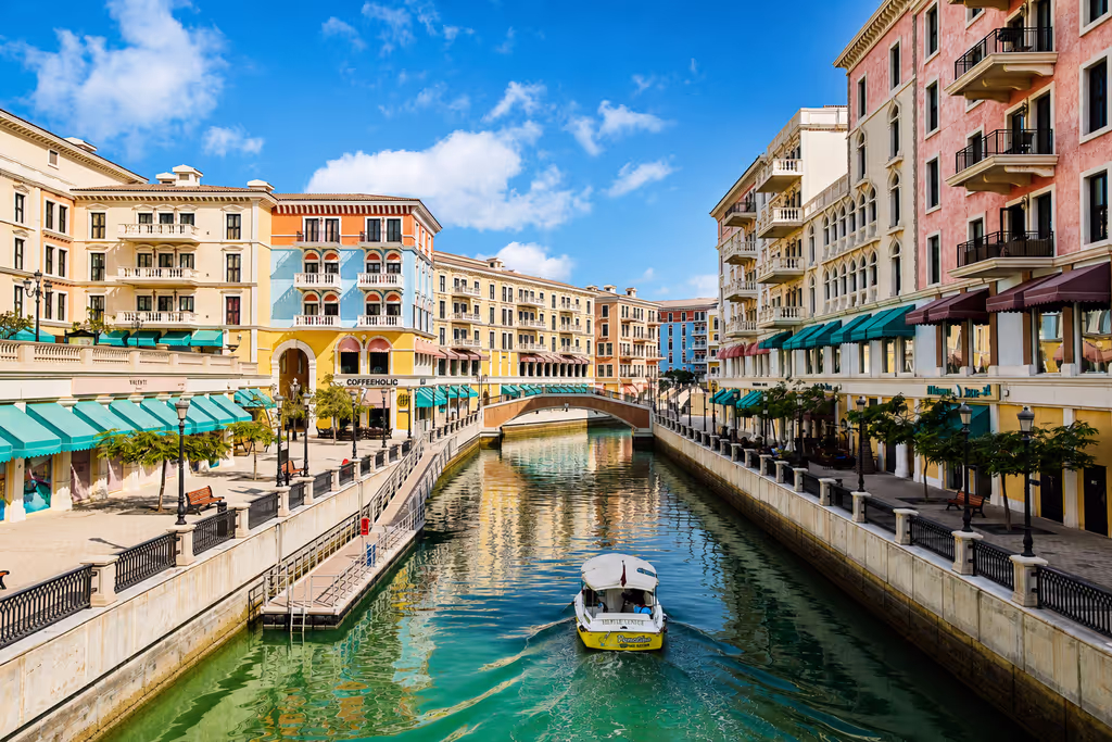Doha Private Tour - Enjoy waterfront views and Mediterranean-style architecture at The Pearl-Qatar’s Qanat Quartier.