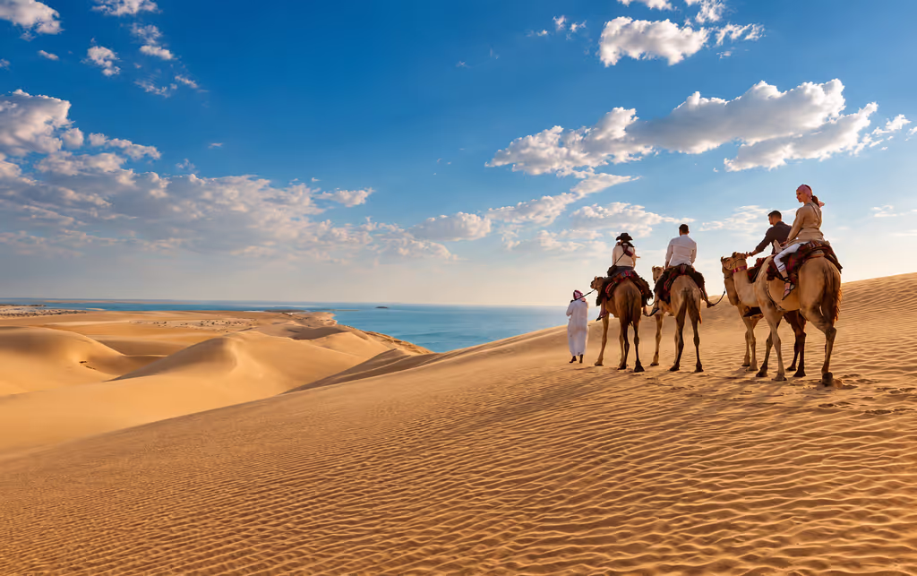 Doha Private Tour - Explore Qatar’s golden dunes and coastal desert scenery on a memorable camel ride.