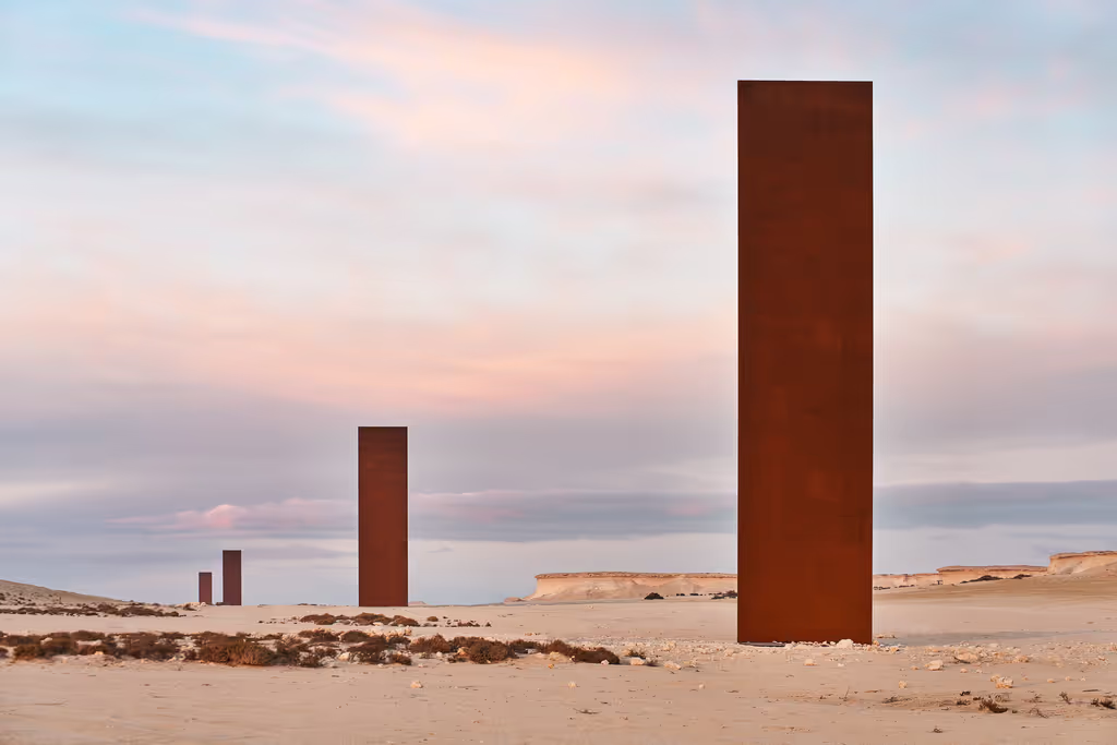 Doha Private Tour - Visit Richard Serra’s East-West/West-East sculpture in Qatar’s dramatic desert landscape.