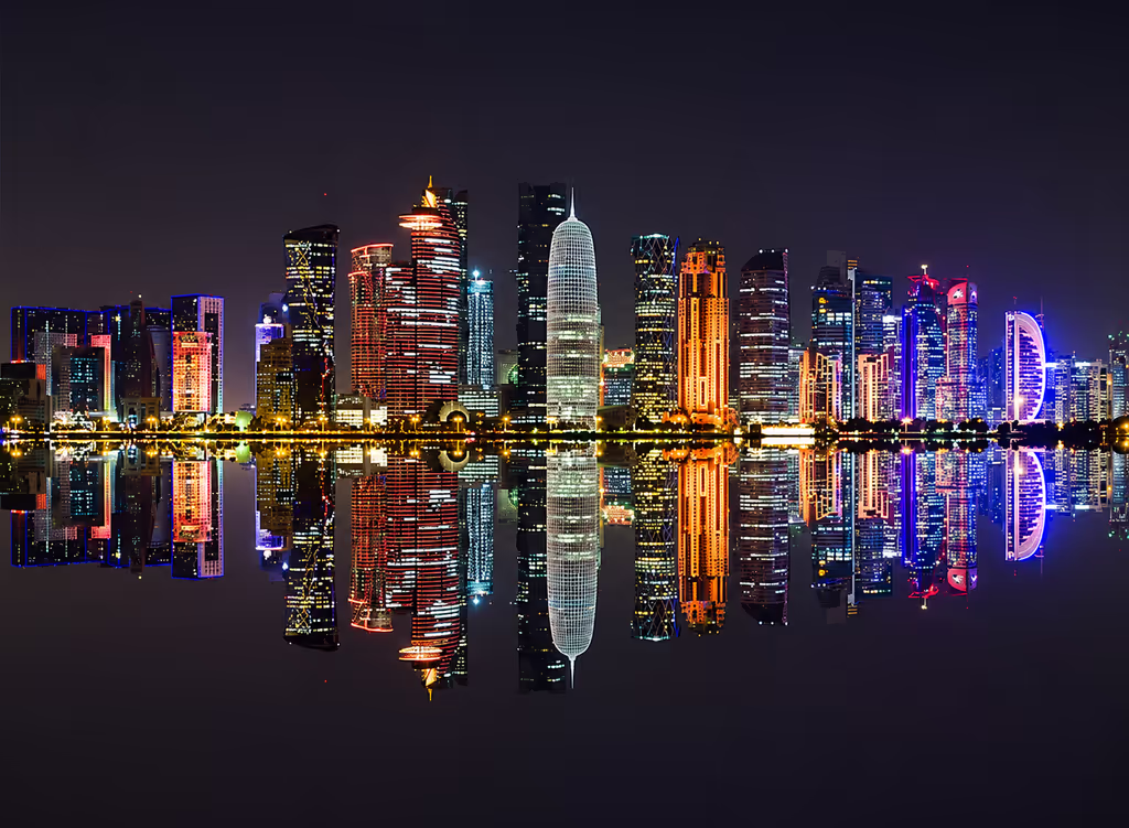 Doha Private Tour - See Doha’s illuminated skyline reflected across the bay during a private night city tour.