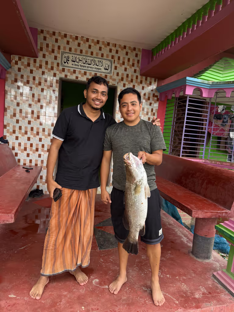 Dhaka Private Tour - Catching fish from the village area