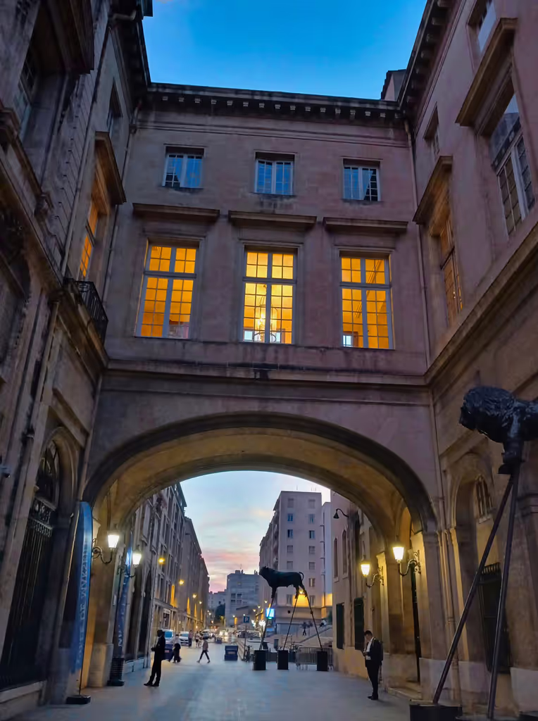 Marseille Private Tour - A walkway connecting the 13th century Hotel de Ville (left) to the 16th century Pavillion Puget (right) constructed by one of the town's leading merchant families. Presently both serve as the seat of municipal governance.