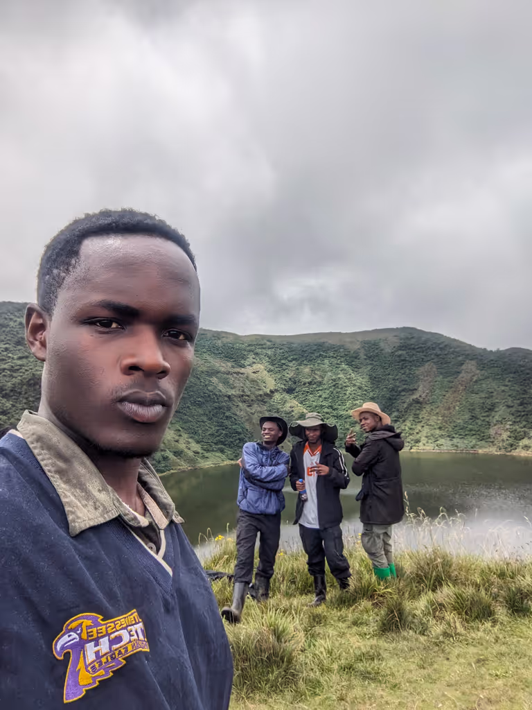 Ruhengeri Private Tour - Guiding guests at crater lake at top of Bisoke volcano