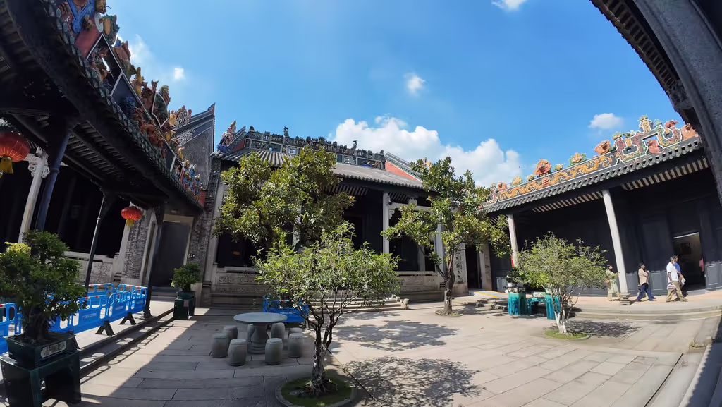 Guangzhou Private Tour - The ornate courtyard of the Chen Clan Ancestral Hall, showcasing exquisite Lingnan architecture.