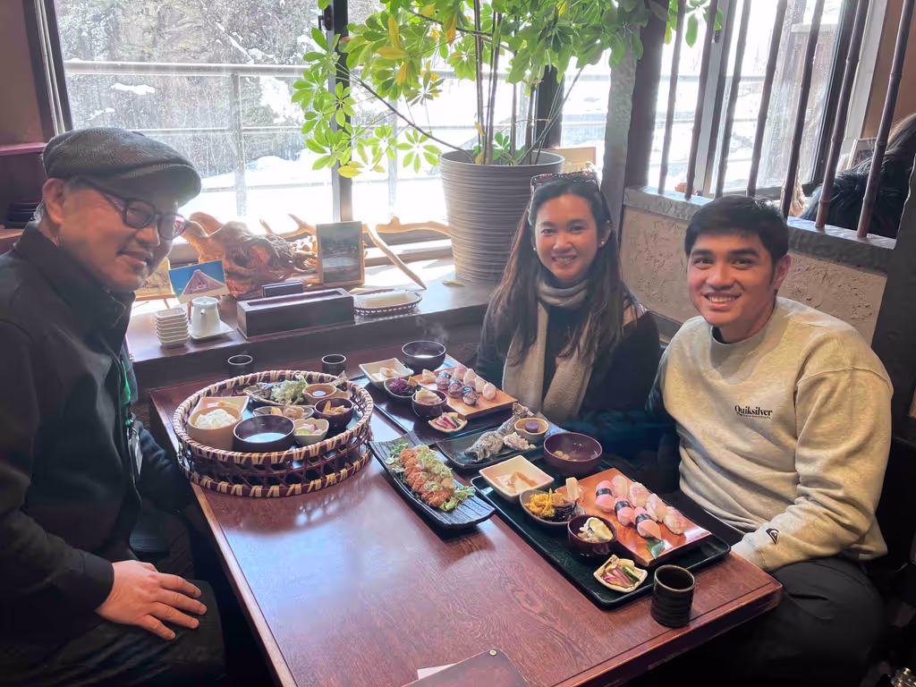 Toyama Private Tour - Guests enjoying iwana sushi with Naoto