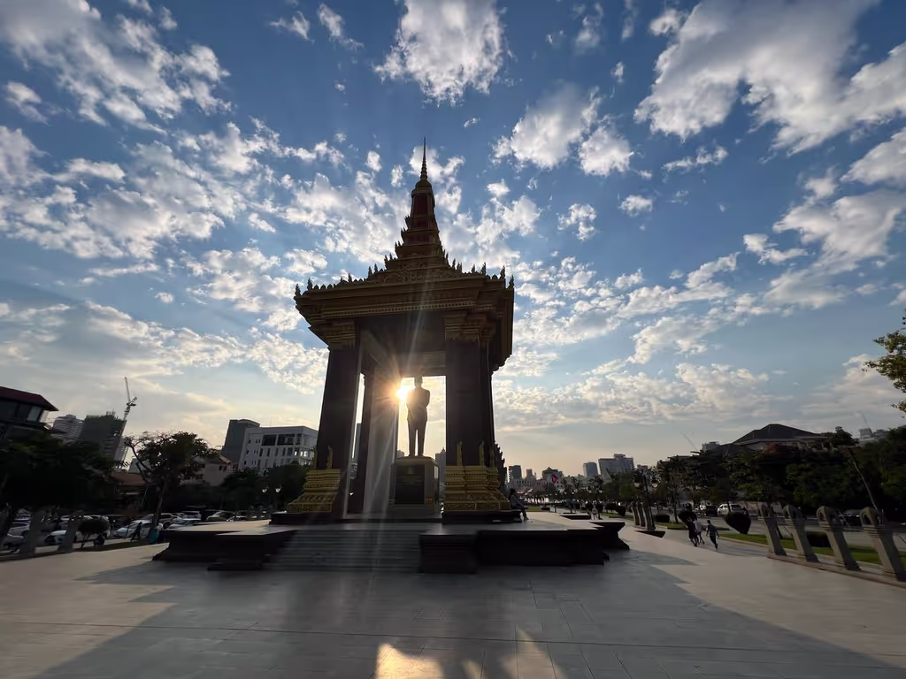 Siem Reap Private Tour - Statue of King Norodom Sihanouk, Phnom Penh – a grand memorial honoring Cambodia’s late King Father, celebrated for leading the nation to independence in 1953. The golden pavilion glows beautifully at sunrise and sunset, symbolizing his enduring legacy.