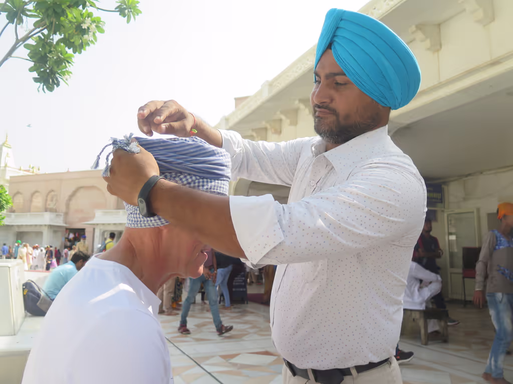 Amritsar Private Tour - A moment of respect — tying a turban before stepping into the Golden Temple.