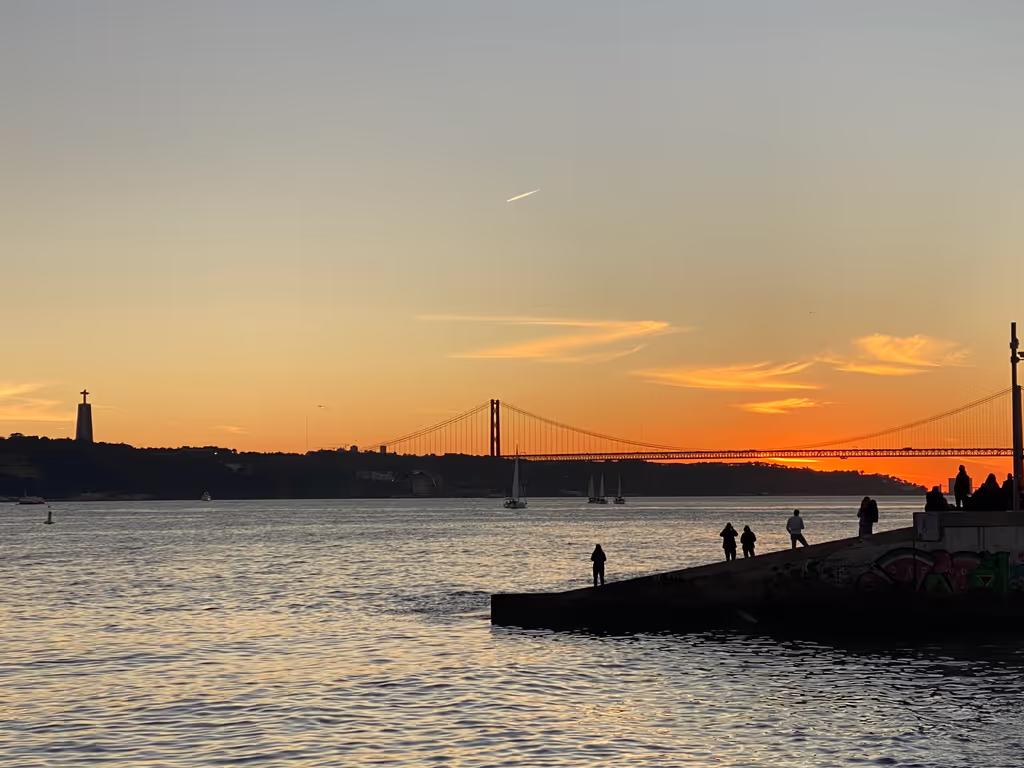 Lisbon Private Tour - One of the beautiful sunsets from Cais do Sodré in Lisbon city center with the view if Almada, 25 de Abril Bridge and Cristo Rei