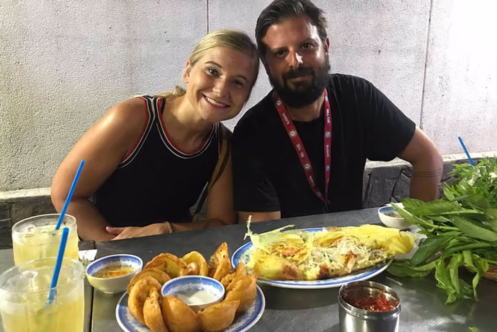 Ho Chi Minh Private Tour - Germany tourists smile with their Bánh Xèo