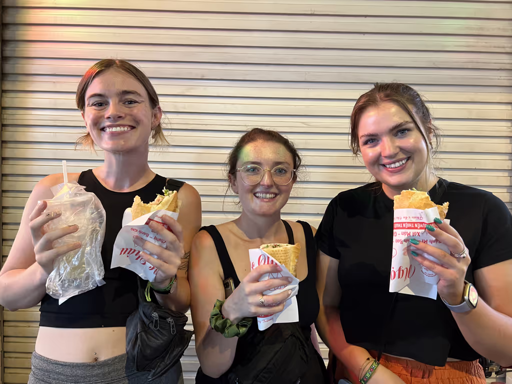 Ho Chi Minh Private Tour - American enjoy their first Bánh Mì