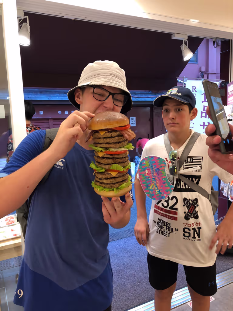 Tokyo Private Tour - Biting a huge hamburger, a fake food, though