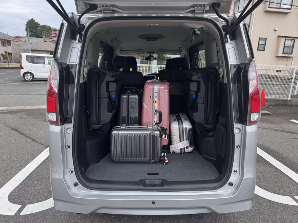 Nagasaki Private Tour - Image of a family of four with four suitcases