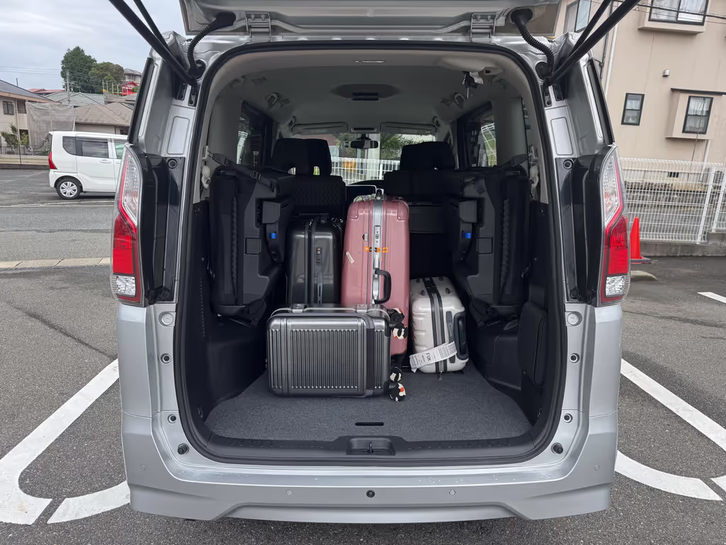 Fukuoka Private Tour - Image of a family of four with four suitcases