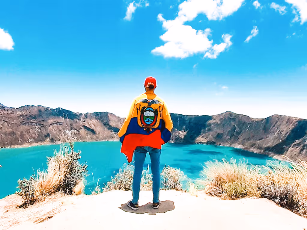 Quito Private Tour - Traveler with Ecuadorian flag appreciating the lan
