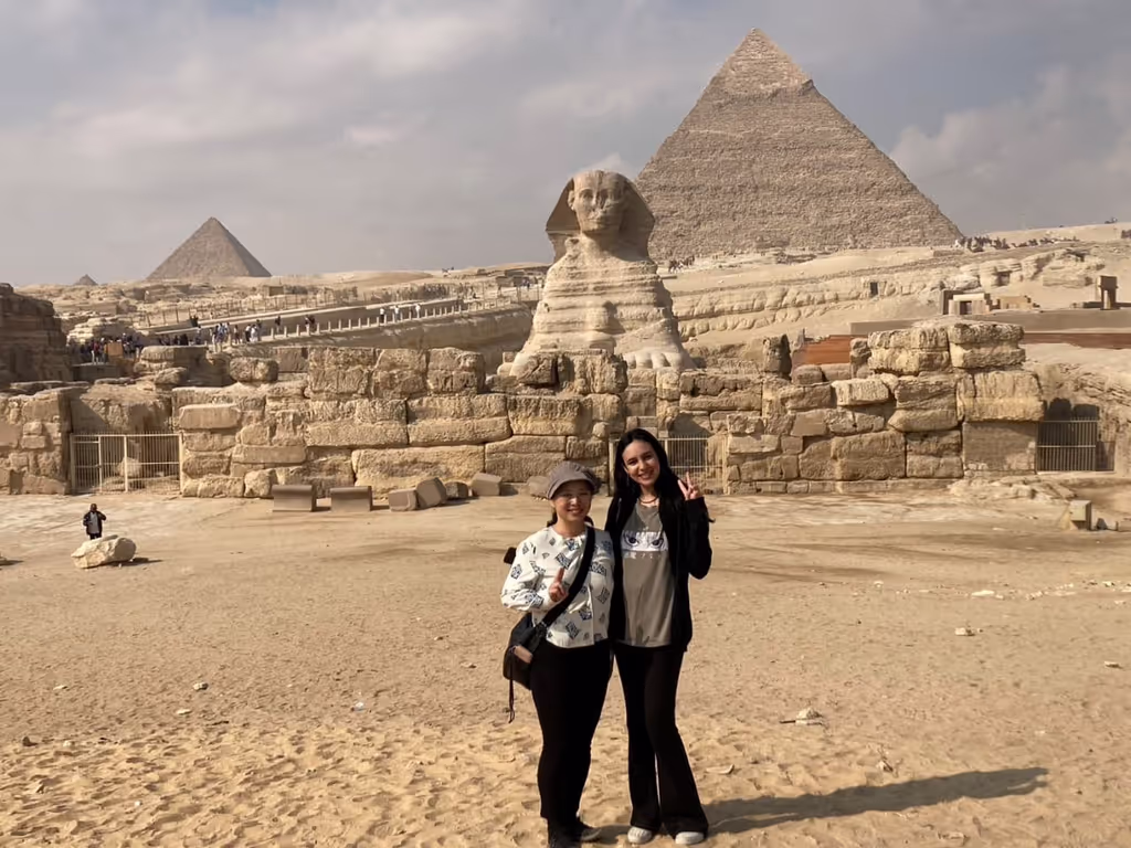 Giza Private Tour - with Kaori san in front of sphinx and the valley.