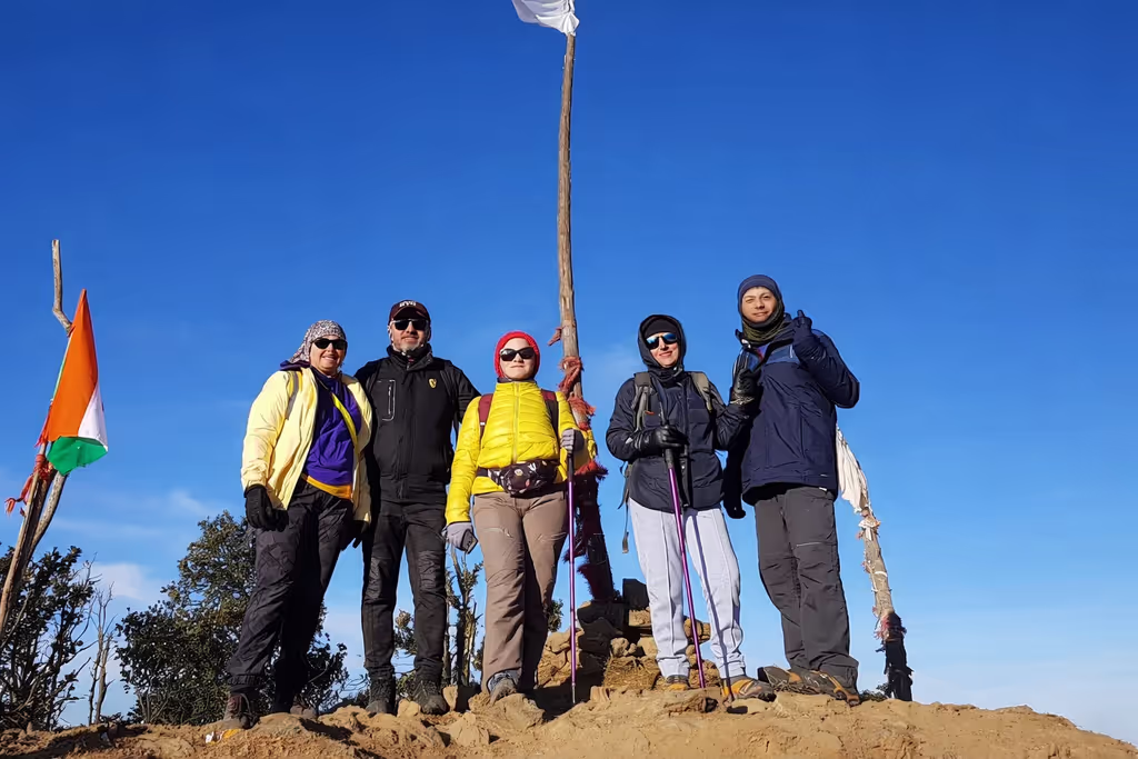Rishikesh Private Tour - Summit celebration with flags flying