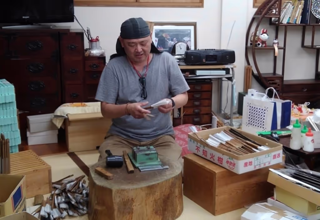 Nagoya Private Tour - He is a shop owner and a craftsman of making folding fan, he teaches you how to make a fan so politely.
