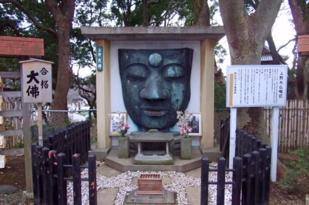 Tokyo Private Tour - The face of this Buddha statue was fallen down by the big earth quake in 1923