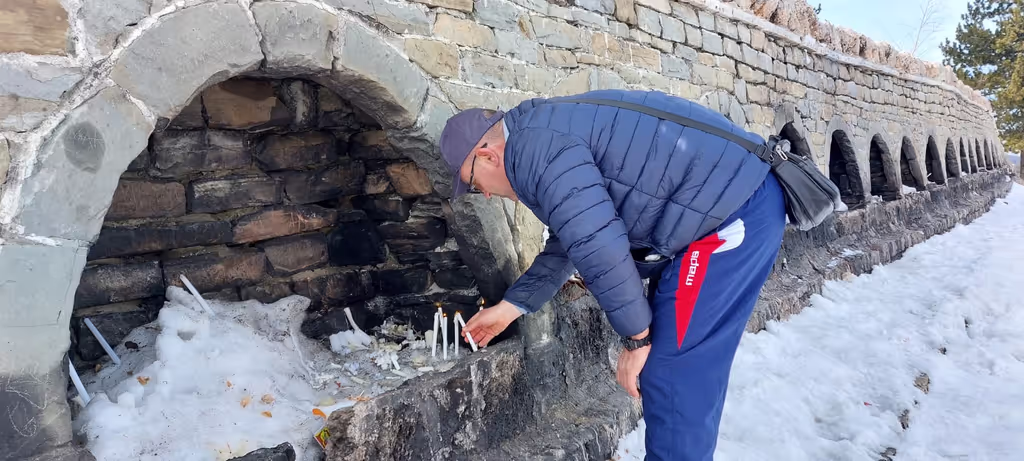 Tirana Private Tour - Lighting candles at the holly place