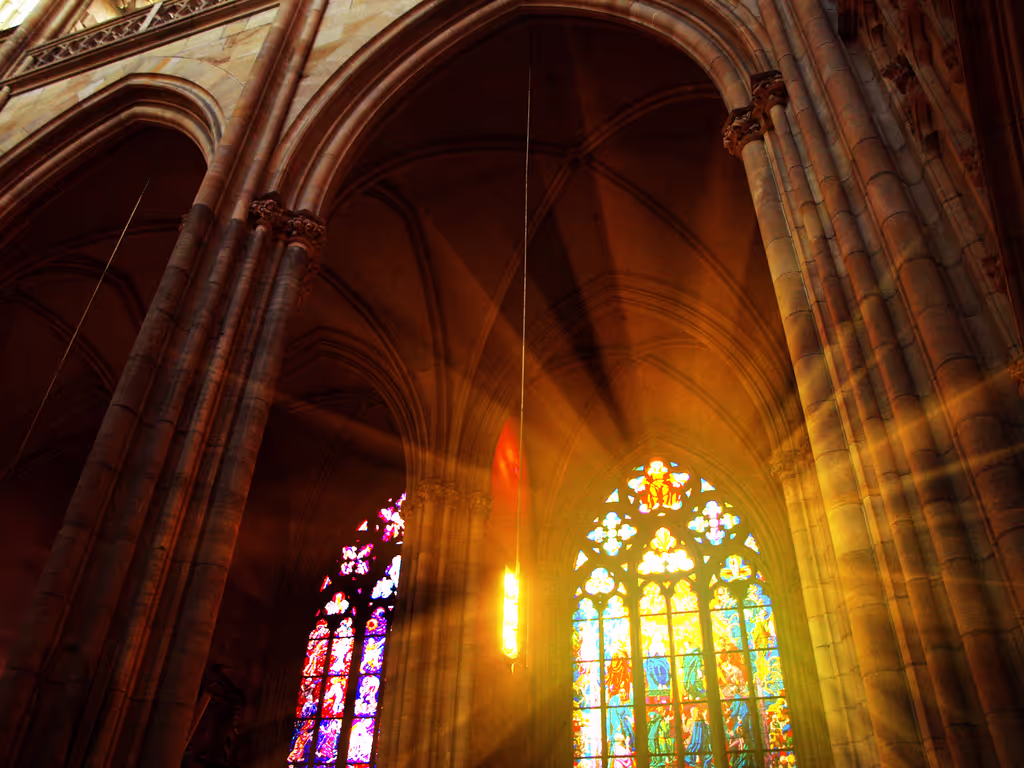 Prague Private Tour - Light seeping through the beautiful colored glass inside of the Cathedral.