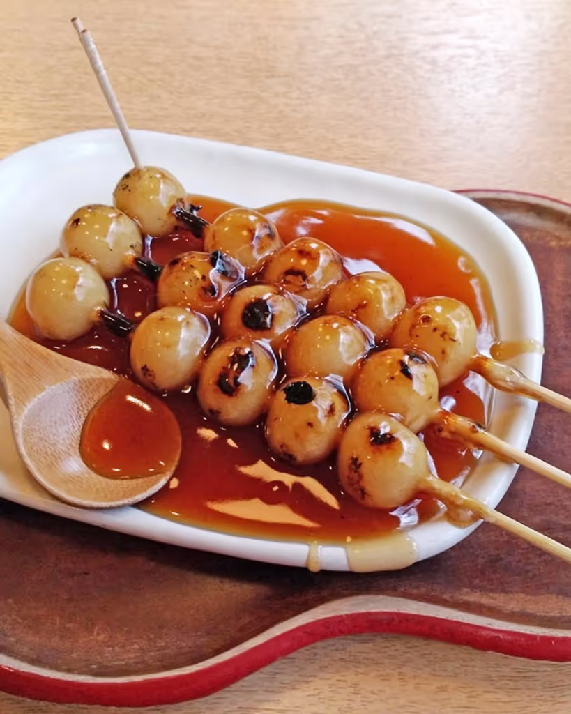 Kyoto Private Tour - Skewered steamed, baked dumpling with brown sugar paste.
We sometime take this with Japanese tea.
It will cost about Jyen500 per plate, 3 skewered gumpling. Wendy’s day off day
