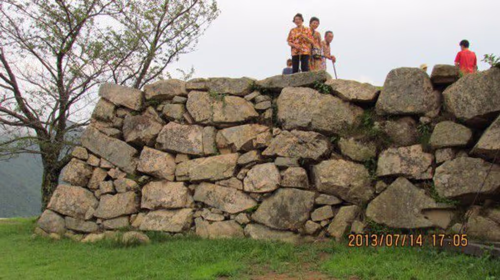 Osaka Private Tour - Some people are on the ruins of donjon at the ruins of Takeda Castle