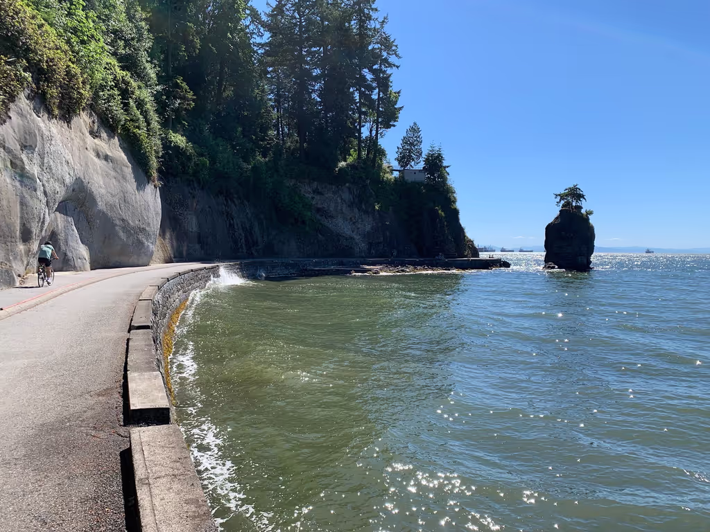 Vancouver Private Tour - Stanley Park Seawall with Siwash rock in the background.