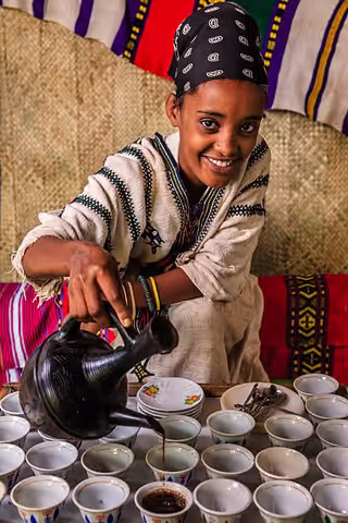The preparation of traditional Ethiopian cuisine, along with the cultural coffee ceremony