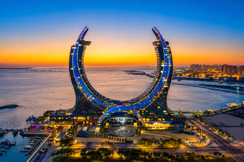 Doha Private Tour - Capture the iconic Katara Towers at sunset in Lusail Marina, Qatar.