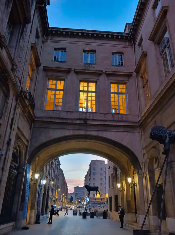 Marseille Private Tour - A walkway connecting the 13th century Hotel de Ville (left) to the 16th century Pavillion Puget (right) constructed by one of the town's leading merchant families. Presently both serve as the seat of municipal governance.