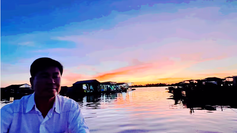 Siem Reap Private Tour - Sunset over the floating village on Tonle Sap Lake – where houses drift on water and daily life flows with the rhythm of Cambodia’s great lake.