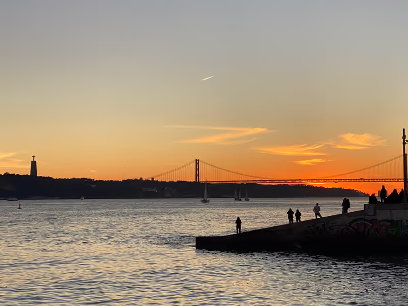 Lisbon Private Tour - One of the beautiful sunsets from Cais do Sodré in Lisbon city center with the view if Almada, 25 de Abril Bridge and Cristo Rei