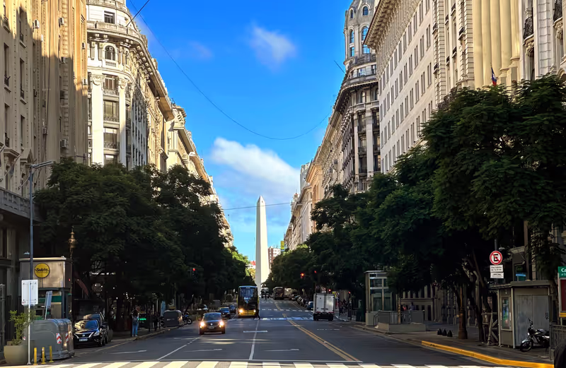 Buenos Aires Private Tour - Marvel at the towering Obelisco, an iconic symbol of Buenos Aires, Argentina. Standing proudly at the intersection of Avenida 9 de Julio and Avenida Corrientes, this magnificent monument represents the city's grandeur and rich history.