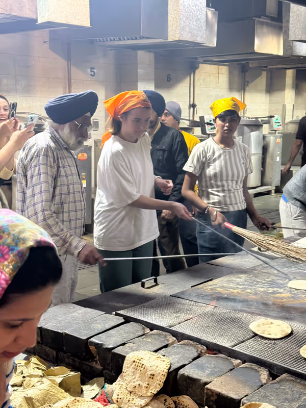 Delhi Private Tour - Our clients serving in Sikh temple.