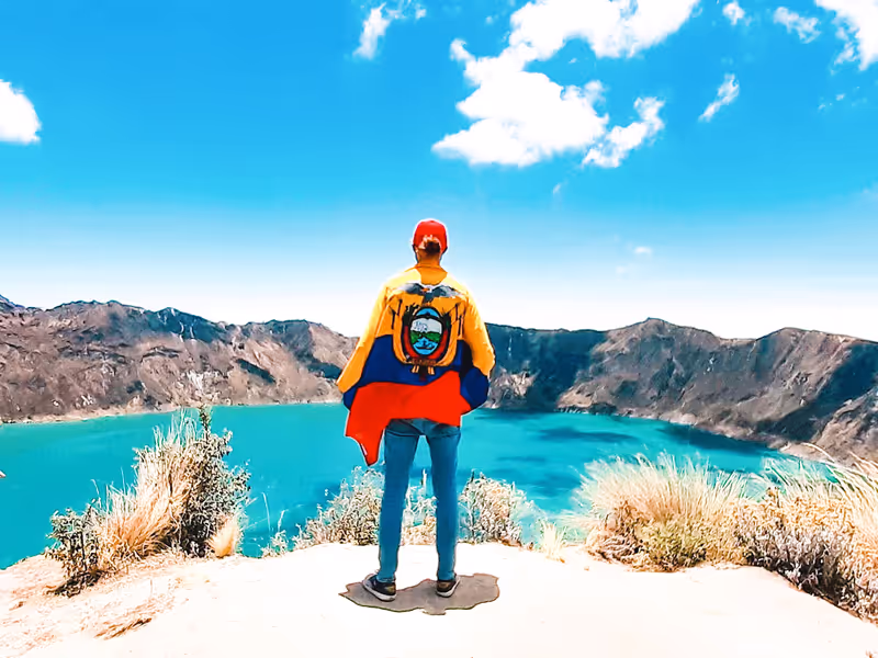 Quito Private Tour - Traveler with Ecuadorian flag appreciating the lan