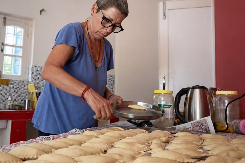 Rishikesh Private Tour - Preparing dough in a cosy kitchen