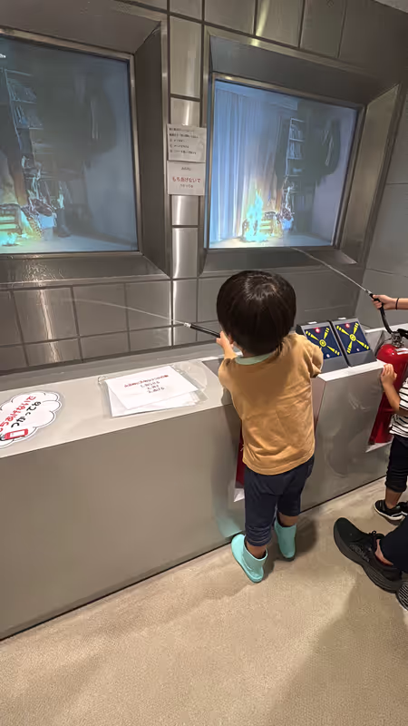 Osaka Private Tour - Practicing with a fire extinguisher.