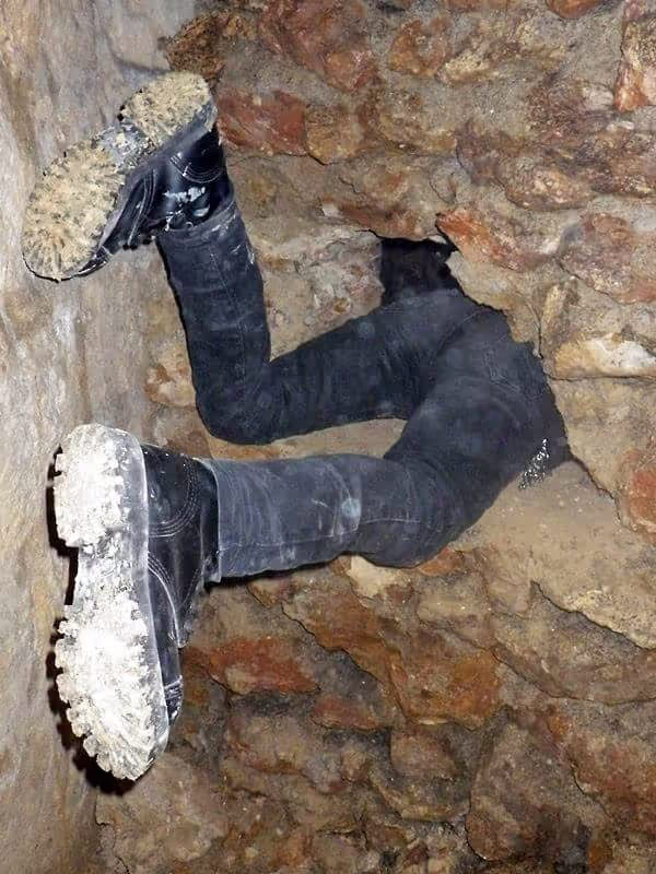 Paris Private Tour - A cataphile sneaking inside a "catflap" passage