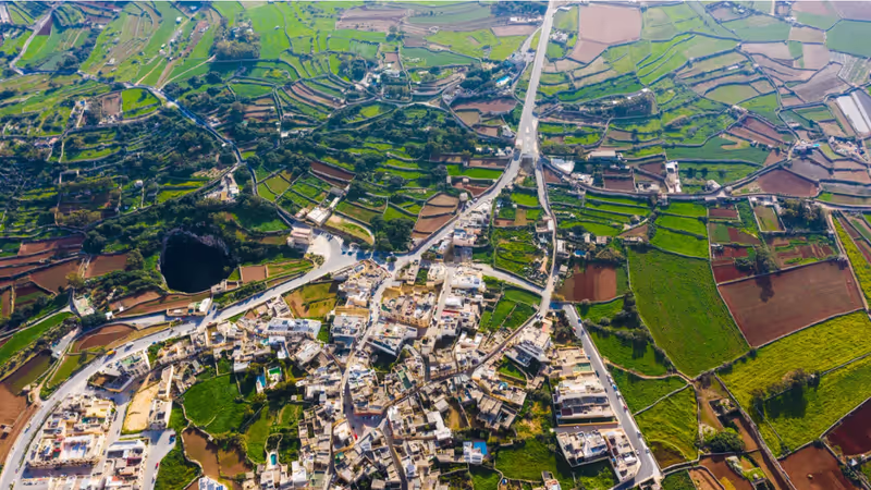Malta Private Tour - Qrendi village from above, it is situated at the south west and is one of the oldest villages on our island. It goes back to Neolithic era. It became a parish in 1618 with population of 1024 where today we count up of 2800 residence only. The motto of the village is 'Tyrium Dirutas Servo Moles' means 'I conserve the buildings of the Phoenicians'. 